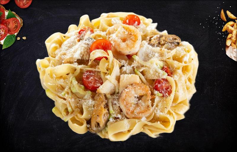 Фетучини с морепродуктами в соусе Том ям