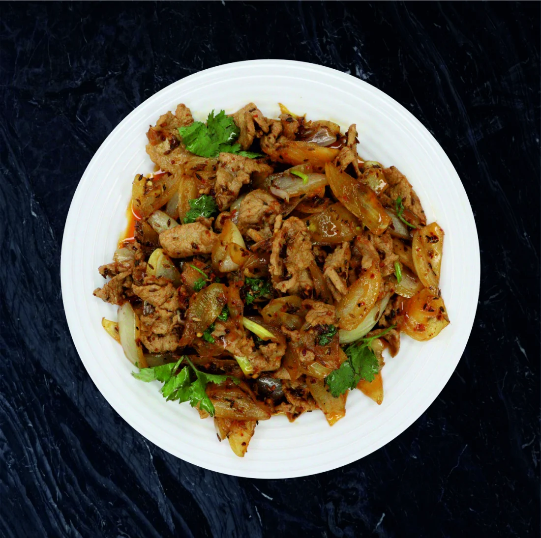 Свинина с луком и зирой