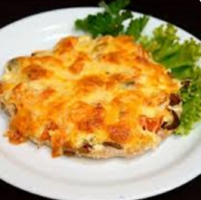 Свинина запеченная с грибами под сыром