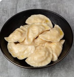 Вареники с тушеной капустой